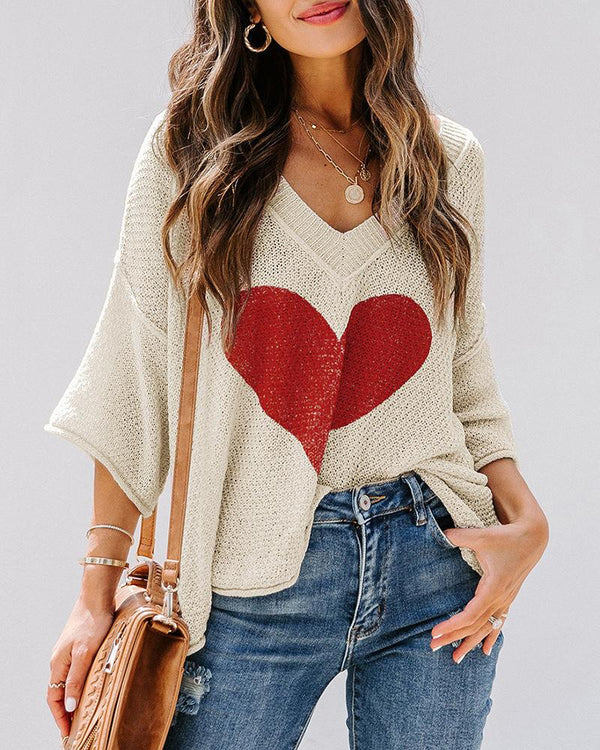 Pull en tricot à manches longues et motif coeur à manches chauve-souris