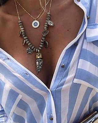 Chemise décontractée rayée avec poches boutonnées