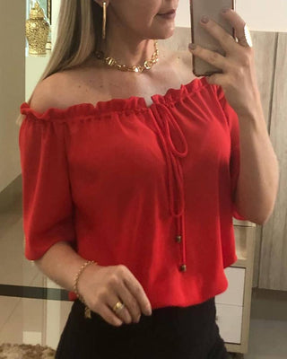 Haut uni à épaules dénudées et ourlet à volants