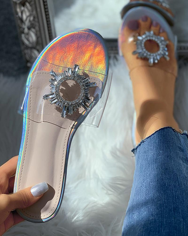 Sandales à glissière plates en plexiglas transparent avec détails de fleurs