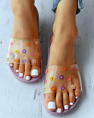 Sandales plates transparentes à motif floral