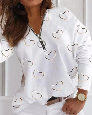 Haut à manches longues à imprimé cœur et fermeture à glissière