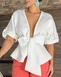 Blouse à basque avec nœuds bowknot et décolleté plongeant