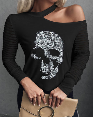 Haut à manches longues en maille à épaules dénudées et motif crâne clouté