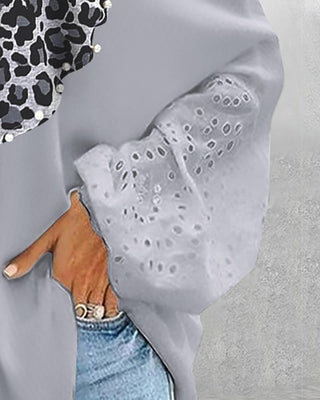 Top brodé à œillets et motif guépard à décor de perles