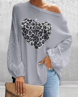 Top brodé à œillets et motif guépard à décor de perles