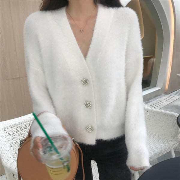 Cardigan duveteux à décor de boutons