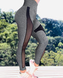 Pantalon de yoga à taille haute en maille transparente évidée