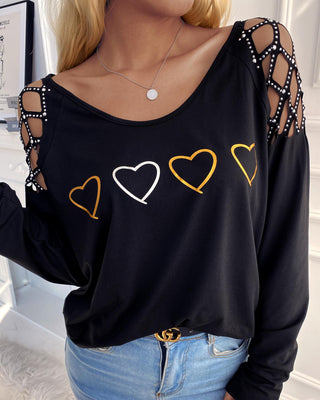 Haut à manches longues évidé et clouté à imprimé cœur