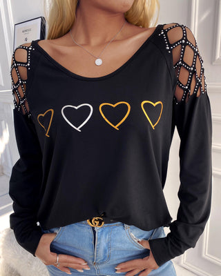 Haut à manches longues évidé et clouté à imprimé cœur
