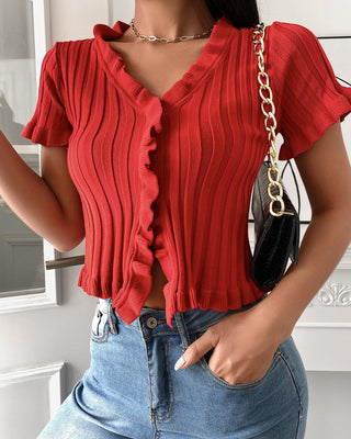 Haut en tricot à manches courtes et ourlet volanté à boutons