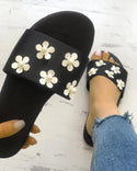 Sandales plates ornées de fleurs à bretelles uniques