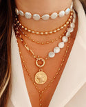 Collier en couches avec pendentif en perles et disque