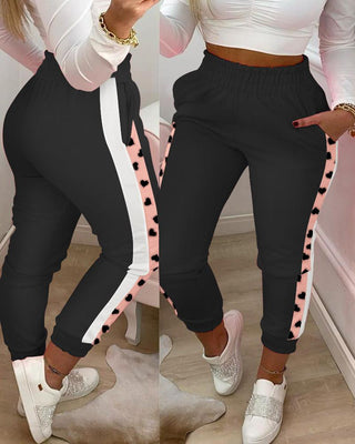 Pantalon décontracté rayé à motif de poche et imprimé coeur