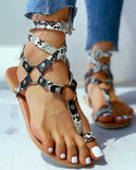Sandales plates avec anneau d'orteil à boucle