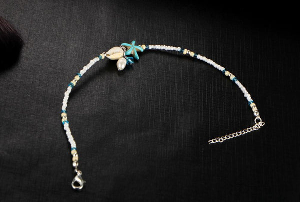 BRACELET DE CHEVILLE COQUILLE ET ETOILE DE MER